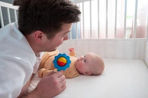 Parent playing with beanbag woth his child Stock Photos