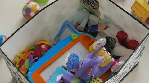 Parent puts toys back into box Video stock 51436154