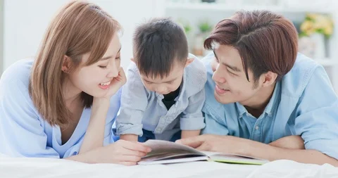 Parent read book with child Stock Footage 106159314