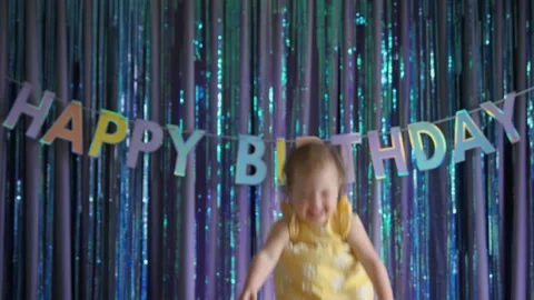 Parent throws laughing happy baby into air at birthday party at home Stock Footage 237165828