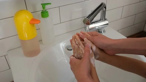 Parent washes the child's hands Stock Footage 156066052