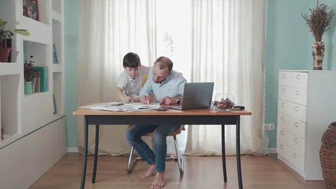 Parent working from home. Remote work. Family on self-isolation. Home office. A Stock Footage 129364425