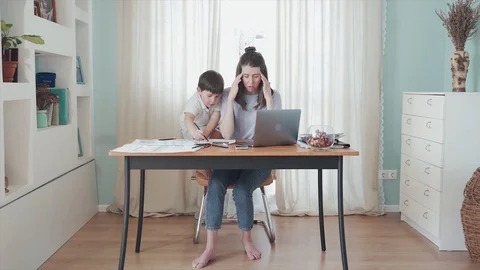 Parent working from home. Remote work. Family on self-isolation. Home office. A Stock Footage 129382616