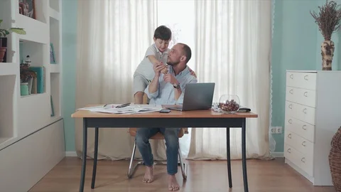 Parent working online from home. Remote work. Family on self-isolation. Home Stock Footage 129367652