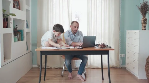 Parent working online from home. Remote work. Family on self-isolation. Home Stock Footage 129368640