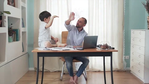 Parent working online from home. Remote work. Family on self-isolation. SLOW MO Stock Footage 129368726