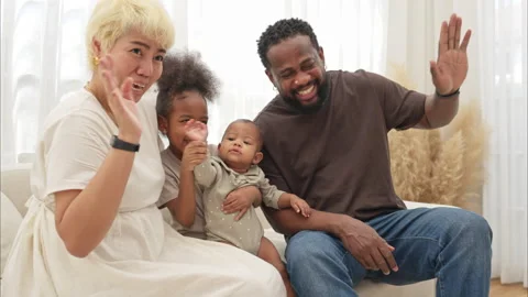 Parents and children relax during their holiday at home Stock Footage 308870853