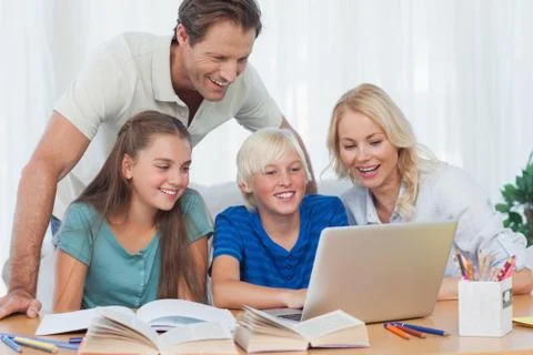 Parents and children using a computer 스톡 사진