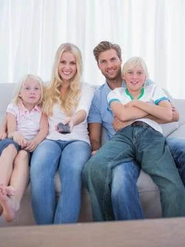Parents and children watching TV Stock Photos
