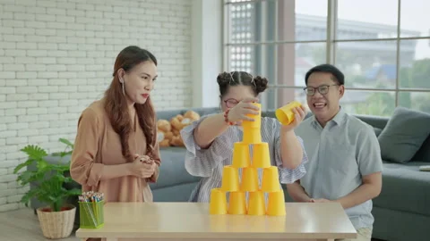 Parents are teaching children with Down syndrome to play SPEED STACKS games Stock Footage 147477330