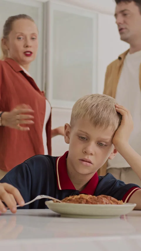 Parents Arguing when Son Dining at Kitchen Vertical 動画素材 281270588