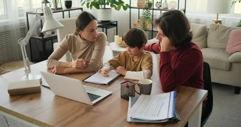 Parents assisting son with homework Stock Footage 145229350