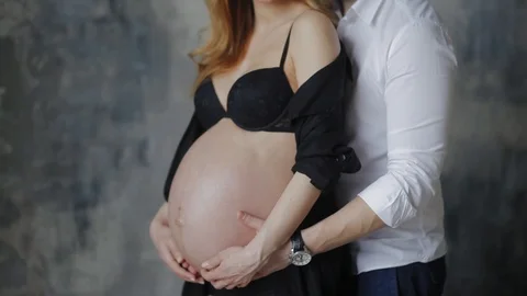 Parents to be are posing for the picture. Stock Footage 87738397