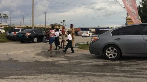 Parents Bringing Children to School on Back to School Day, Freeport Bahamas Stock Footage 94568735