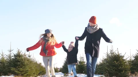 Parents with child running in forest Stock Footage 87394662