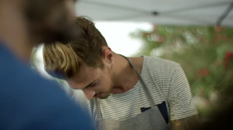 Parents with children drinking juice at park. Stock Footage 63547553