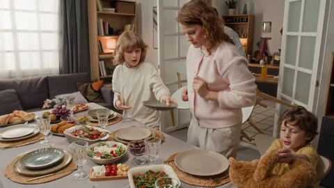Parents with Children Setting Dining Table for Family Dinner Stock Footage 340331682