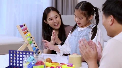 Parents Encourage Child Learning With Abacus at Home Stock Footage 324895134