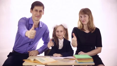 Parents help daughter to do homework Stock Footage 72917115