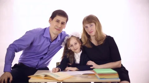Parents help daughter to do homework Stock Footage 72917167