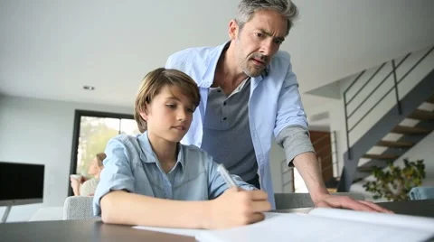 Parents helping kid with homework Stock Footage 48751510