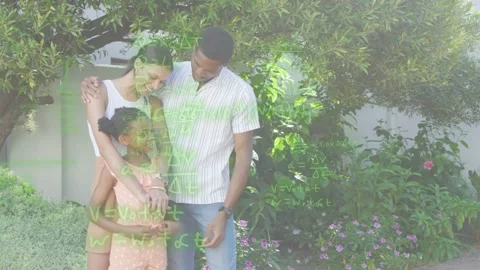 Parents hugging daughter by tree while timed green math overlay fading over them Stock Footage 333477591