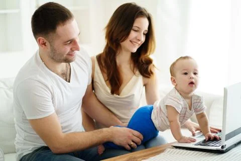 Parents playing developing game with son Stock Photos