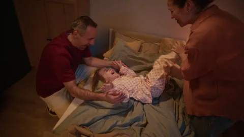 Parents Playing with Loving Kid before Bedtime Stock Footage 327879056