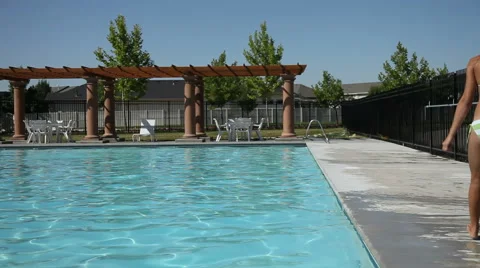 Parents push kids into pool Stock Footage 61659645
