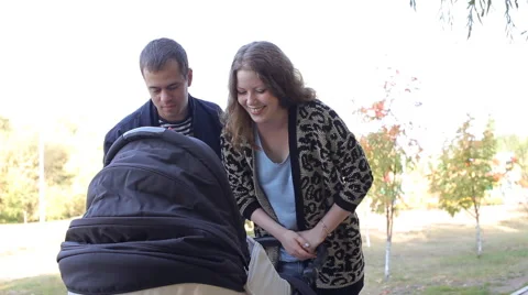 Parents with stroller in park Stock Footage 55938431