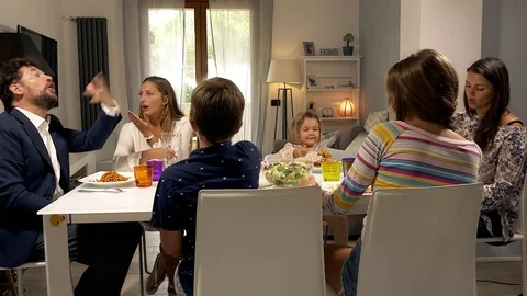 Parents at the table with family fighting strong about education of children Stock Footage