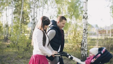Parents walk with child Stock Footage 110895075