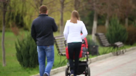 Parents walking with pram. Stock Footage 67615717