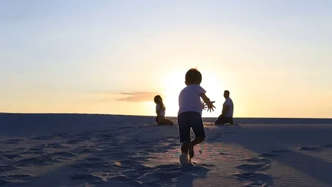 Parents walking at sunset. Stock Footage 80565418