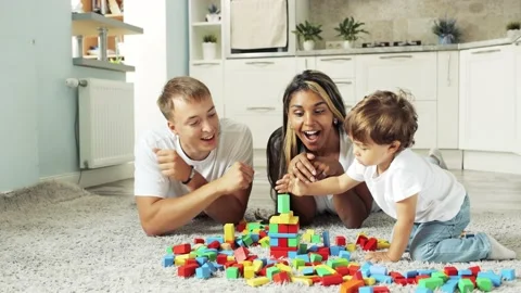 Parents watch the game and the development of their child. Time spent together. Stock-Footage 238764203
