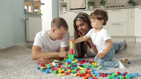 Parents watch the game and the development of their child Stock-Footage 238764279