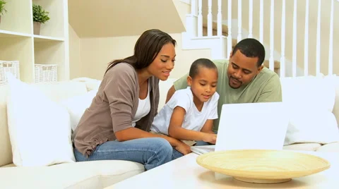Parents Watching Son Using Laptop Computer Video stock 4556109