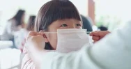 Parents Wear Masks To Children Stock Footage