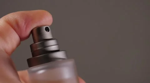 Parfum spraying from bottle close-up FullHD 1080p  slow-mo footage - Parfume Stock Footage 50394405