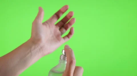 Parfume bottle spray  test  on the hand in front of green screen 4K 3840X2160 Stock Footage 52138382