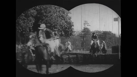 PARIS - 1900 - Racehorses charge down the Auteuil track, leaping over hay and Stock Footage 325217299