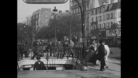 PARIS - 1908 - The couple struggles to bring their cow into the Paris Metro but Stock Footage 308170630