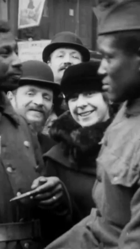 PARIS - 1918 - Black and white soldiers celebrate Armistice Day in the streets Stock Footage 342247390
