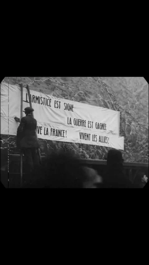 PARIS - 1918 - Men put up banners celebrating Armistice Day in Paris, France, 스톡 동영상 342247161