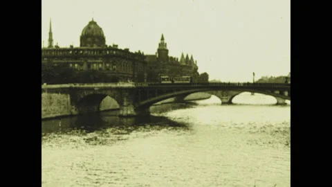 PARIS 1920s: The Concierge on side of river with bridge. Intertitle. Palais du Stock Footage 130357389