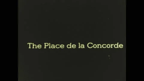 PARIS 1920s: Intertitle. Palace de Concorde. Vehicles drive down road in front Stock Footage 130357269