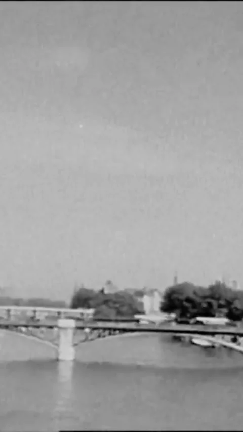 PARIS - 1927 - A camera mounted on a car drives across the Pont Royal to Notre 스톡 동영상 342244818