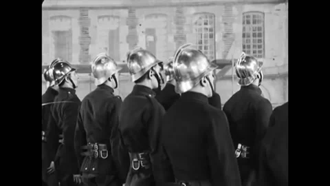 PARIS - 1928 - In this silent comedy, a cop hoses off an excited fireman after Stock Footage 280182969