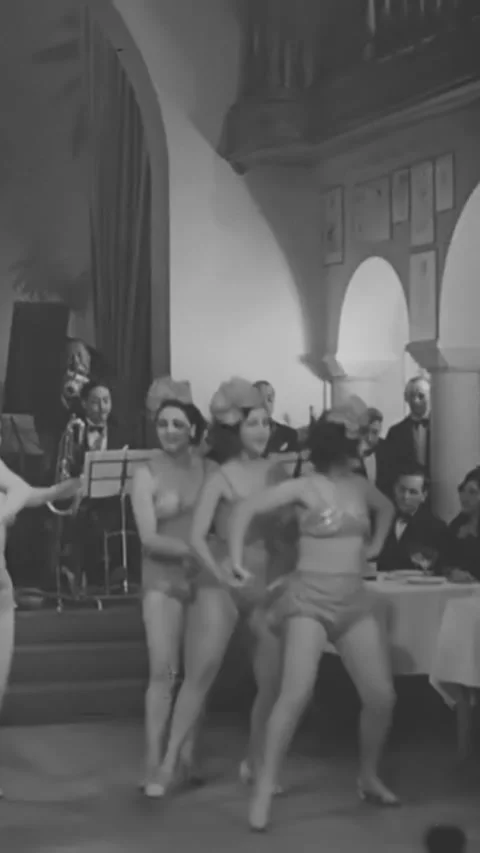 PARIS - 1930s - Couples enjoy dancing at a nightclub in Paris. Stock Footage 342657648