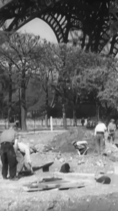PARIS - 1930s - Men construct underground air raid shelters at the base of the Stock-Footage 342250163
